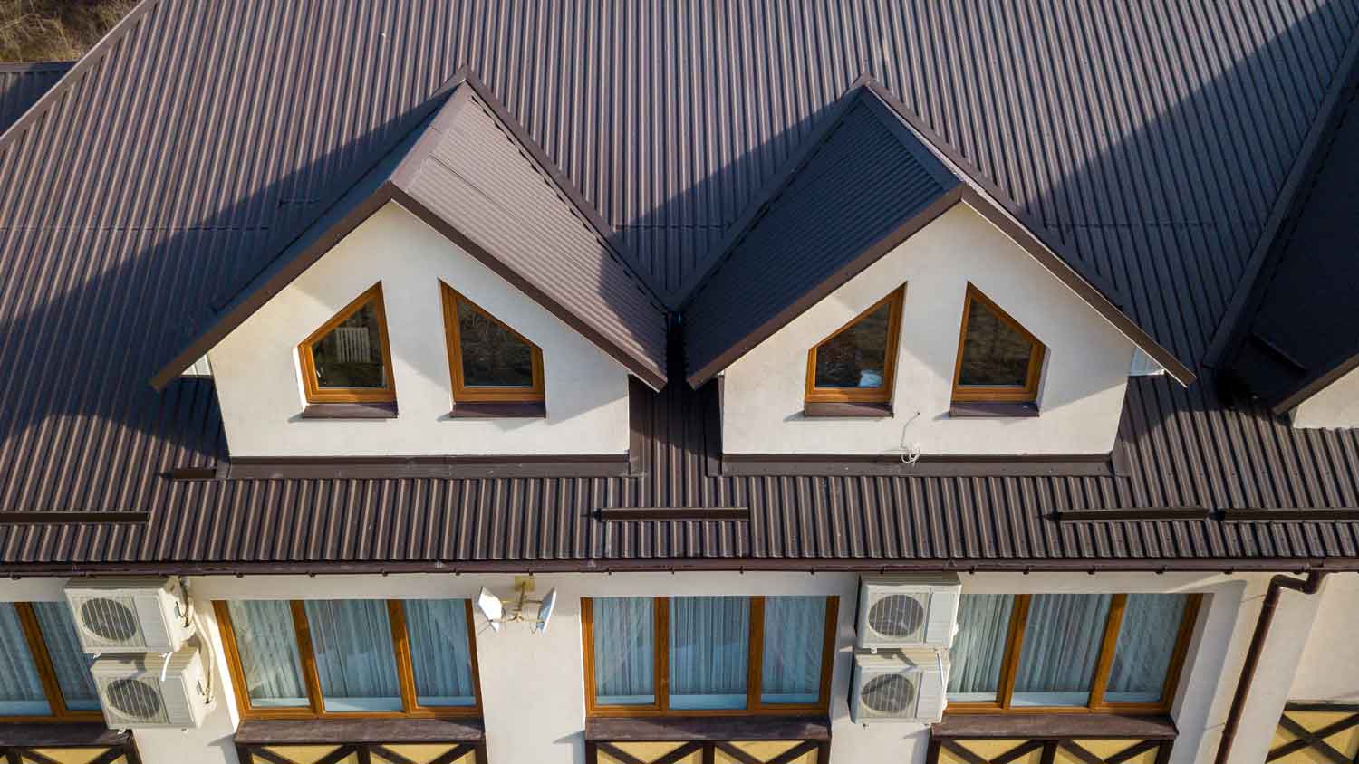 aerial view of home with metal roof