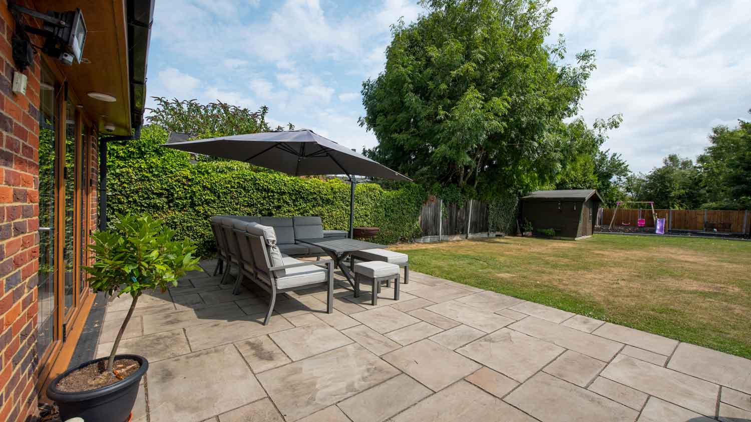 A large backyard with lawn