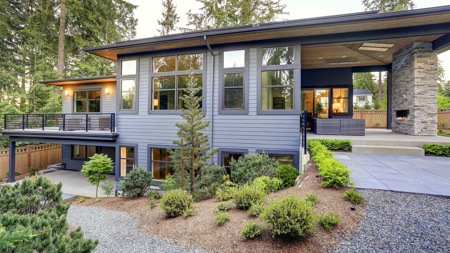 two story home wit gravel pathway