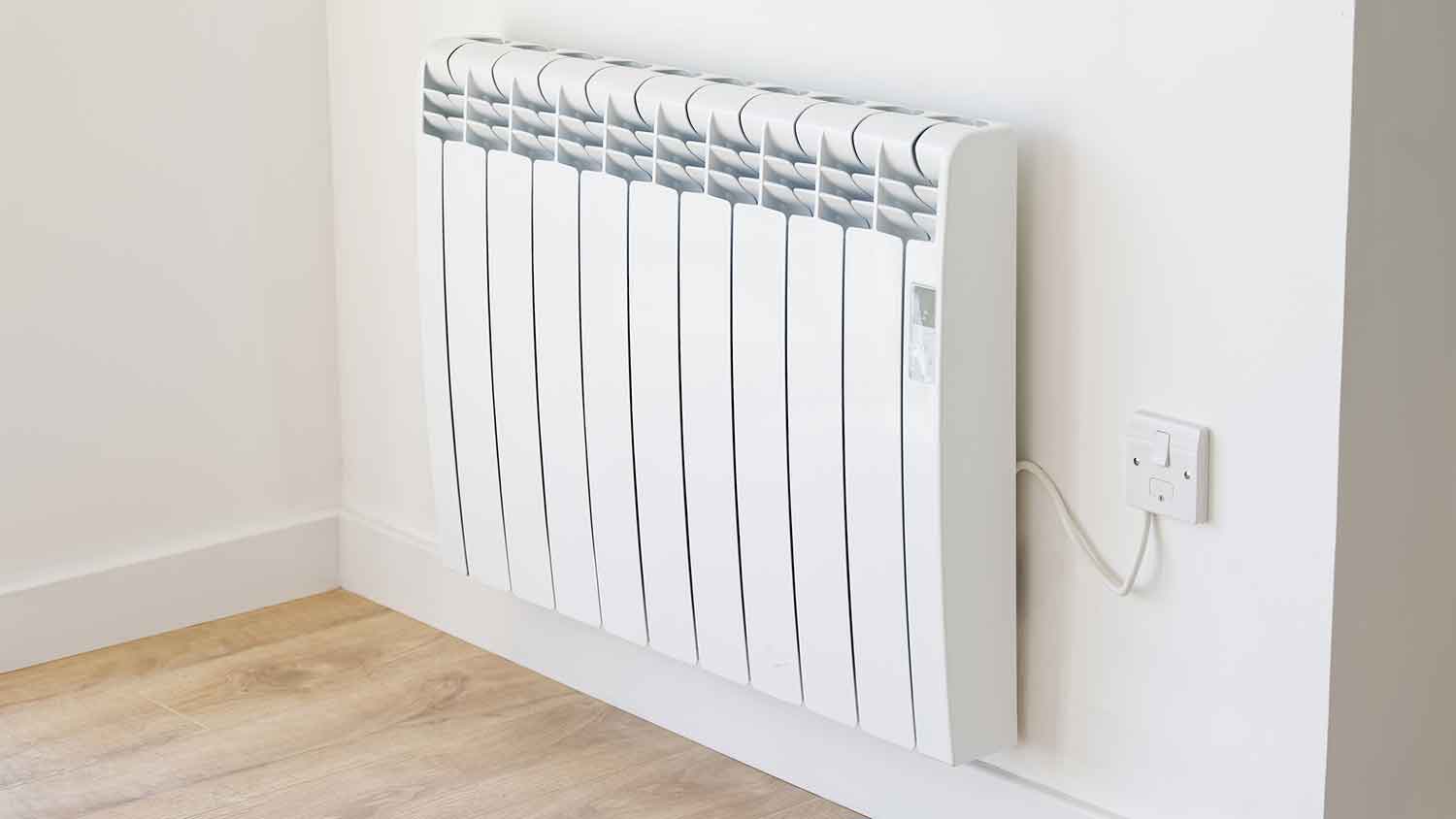 Electric panel radiator mounted on the wall