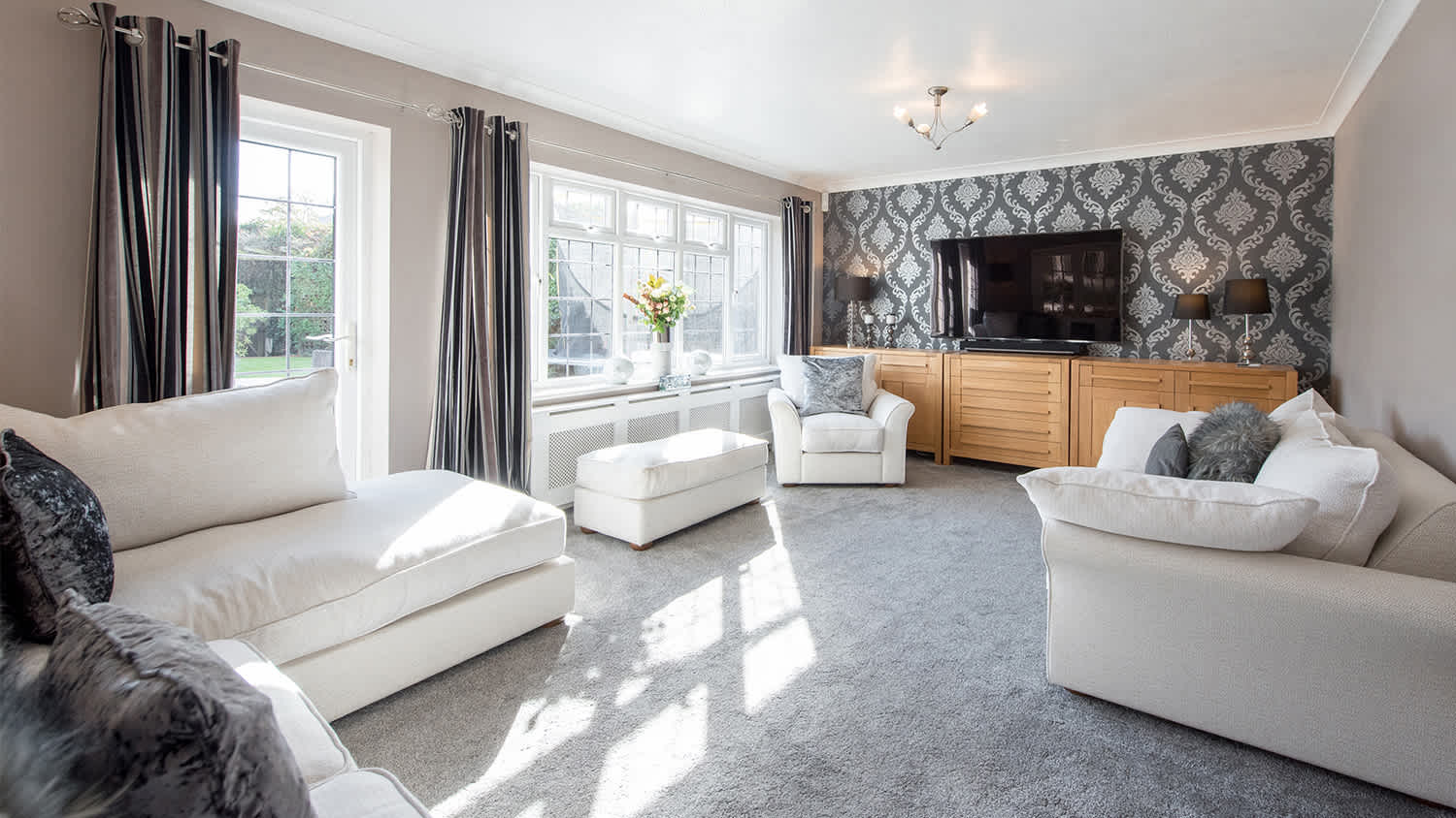 white and grey carpeted living room