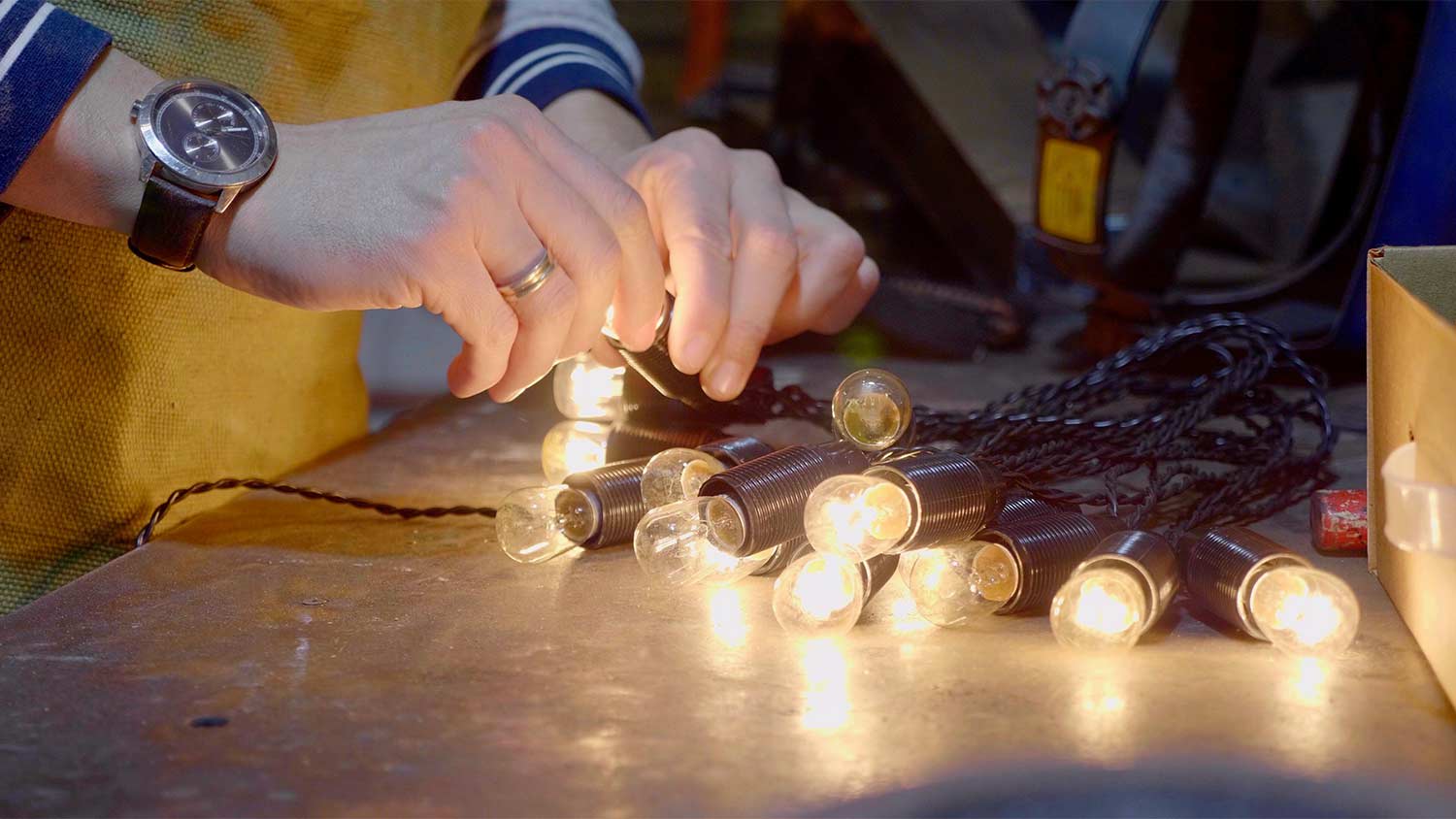 man replacing bad bulbs on lights