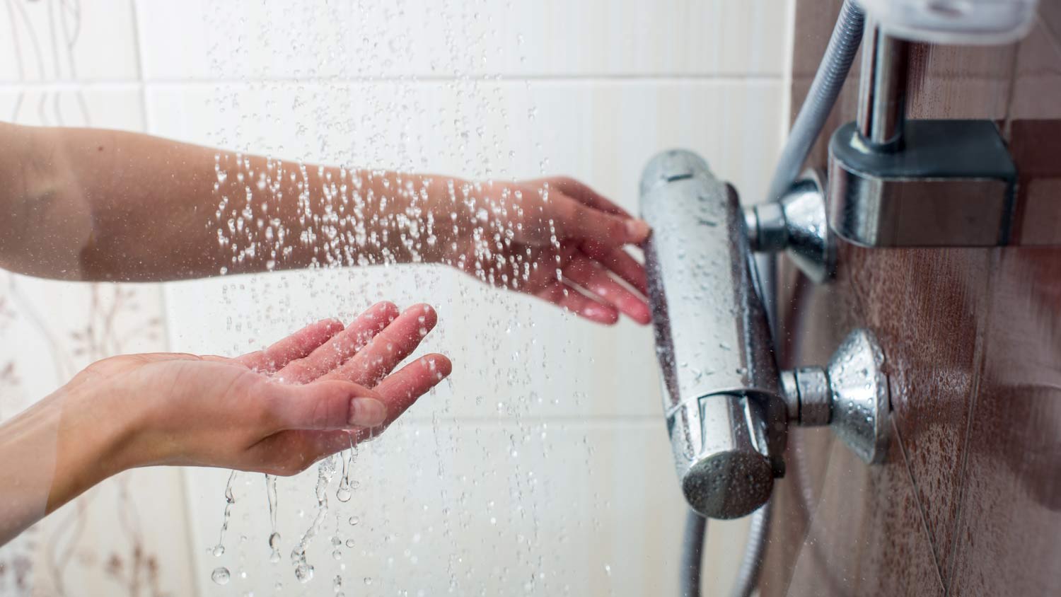 woman taking a hot shower at home