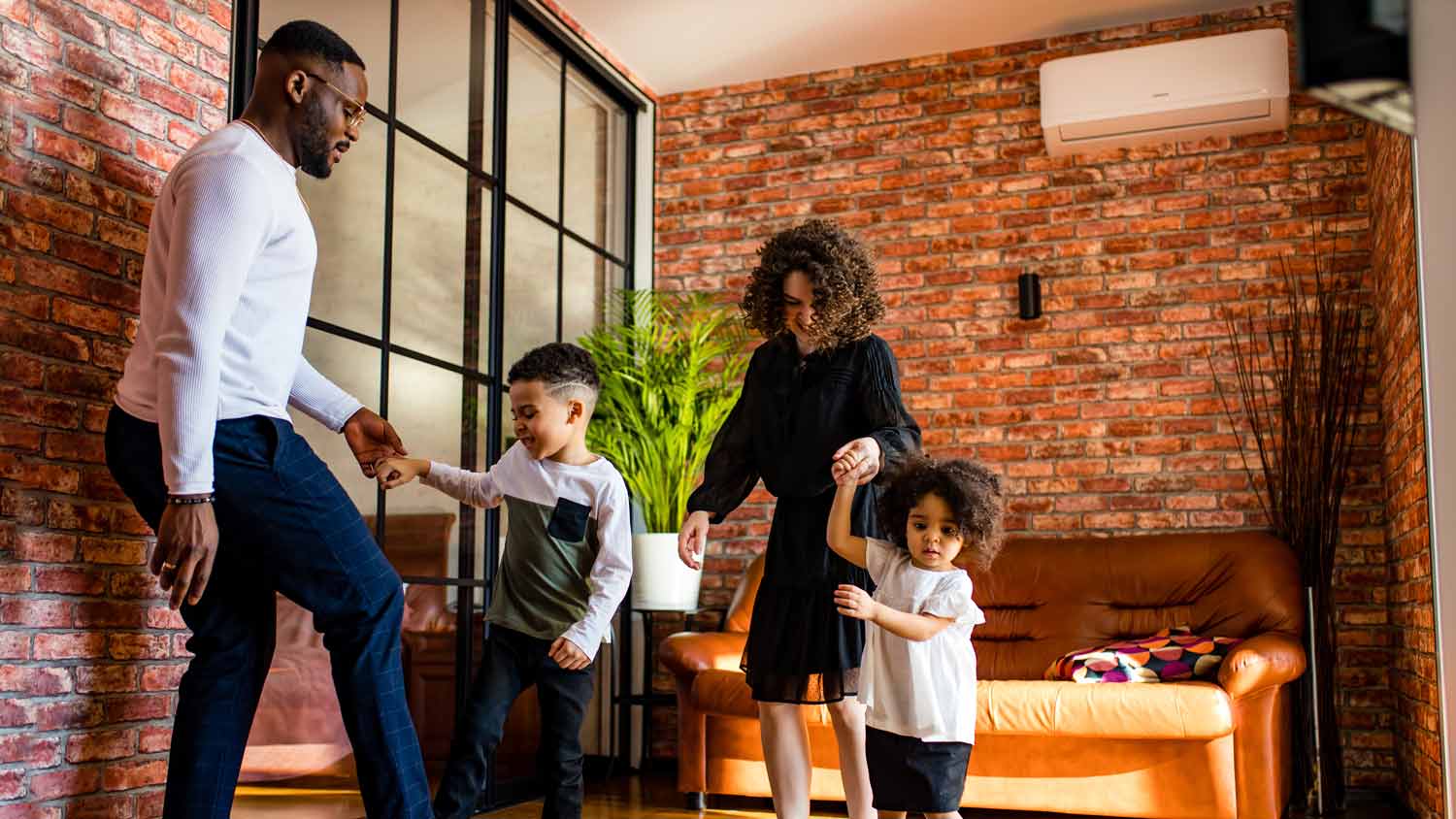 family playing around in air conditioned home