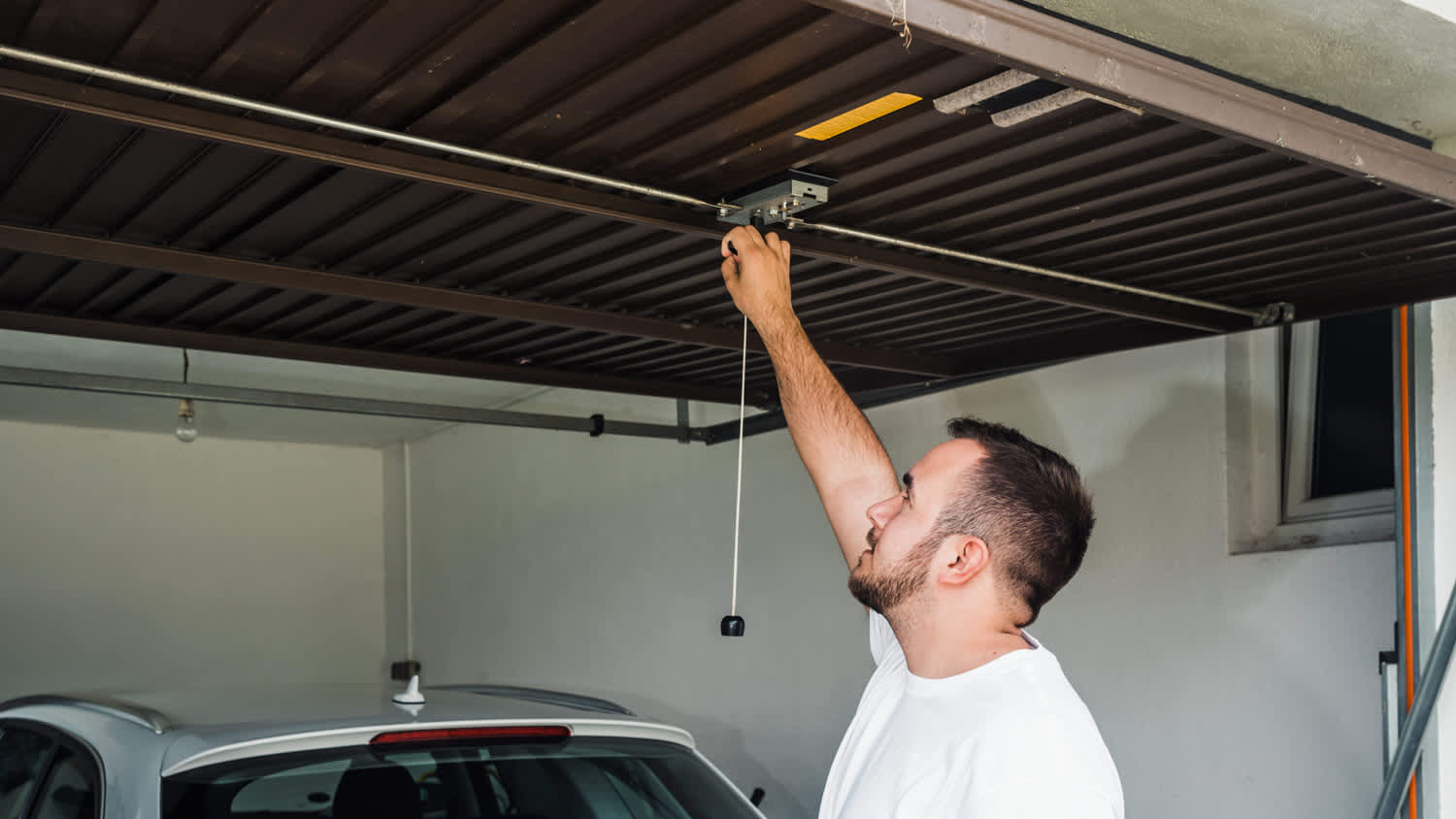 man opens garage door
