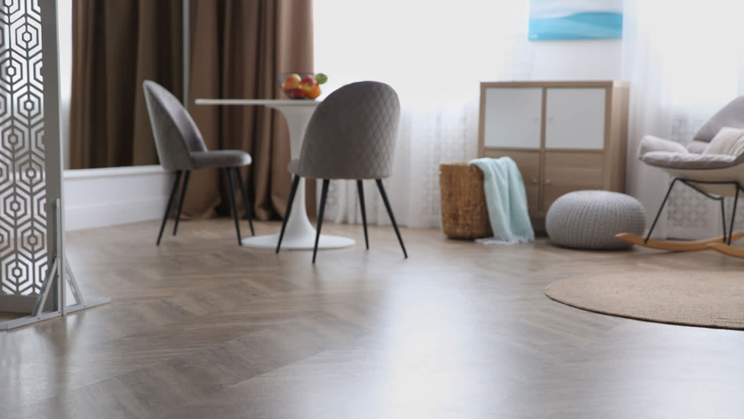 A modern living room with vinyl flooring and stylish furniture