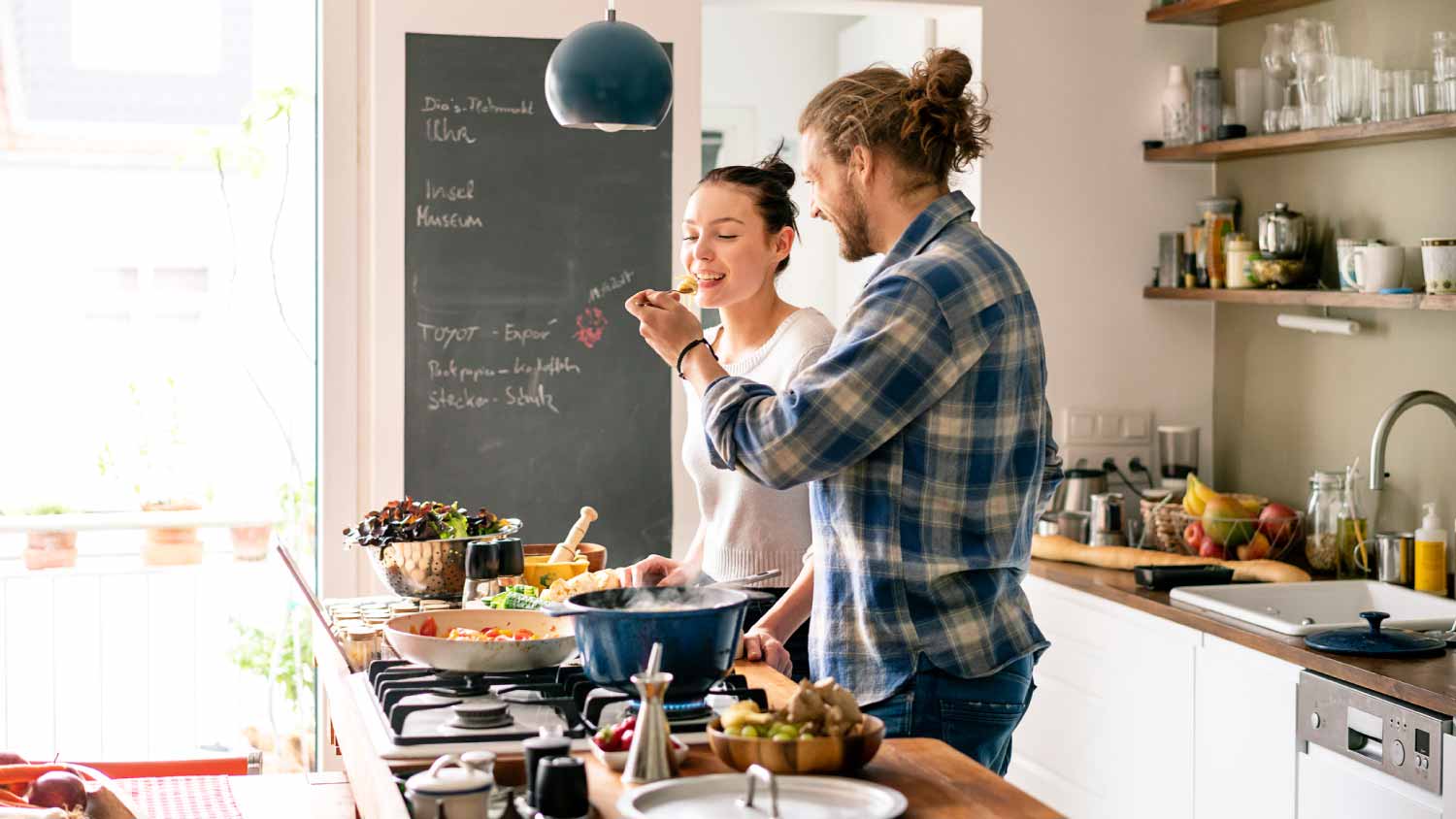 Young couple preparing food