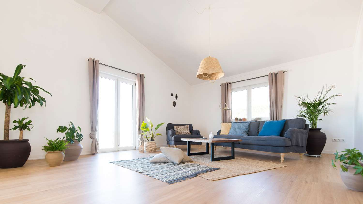 The interior of a modern cozy living room with laminate flooring