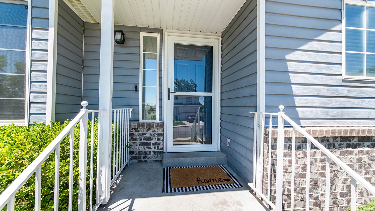A view of a house with a storm door