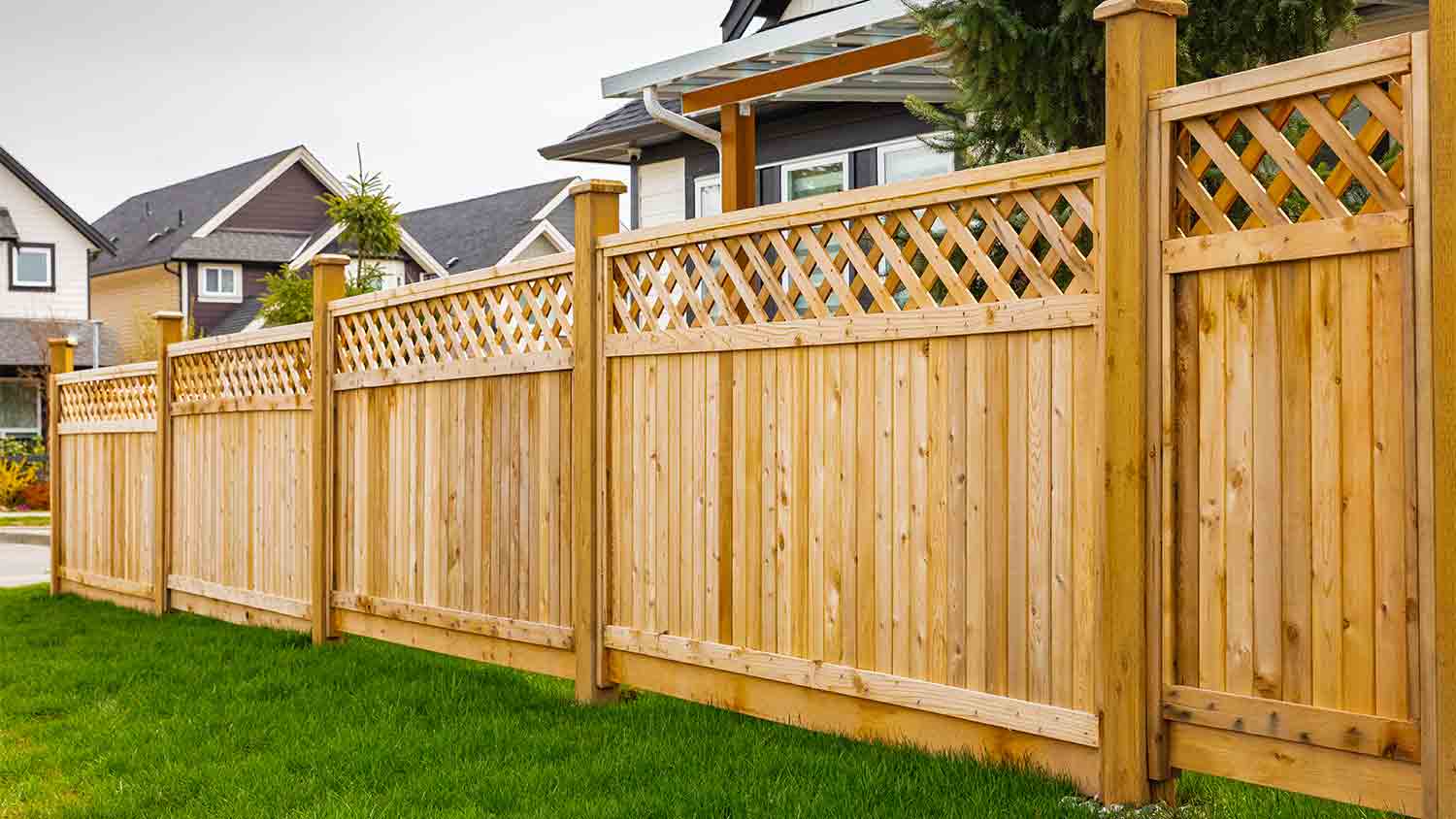 wooden fence surrounding house