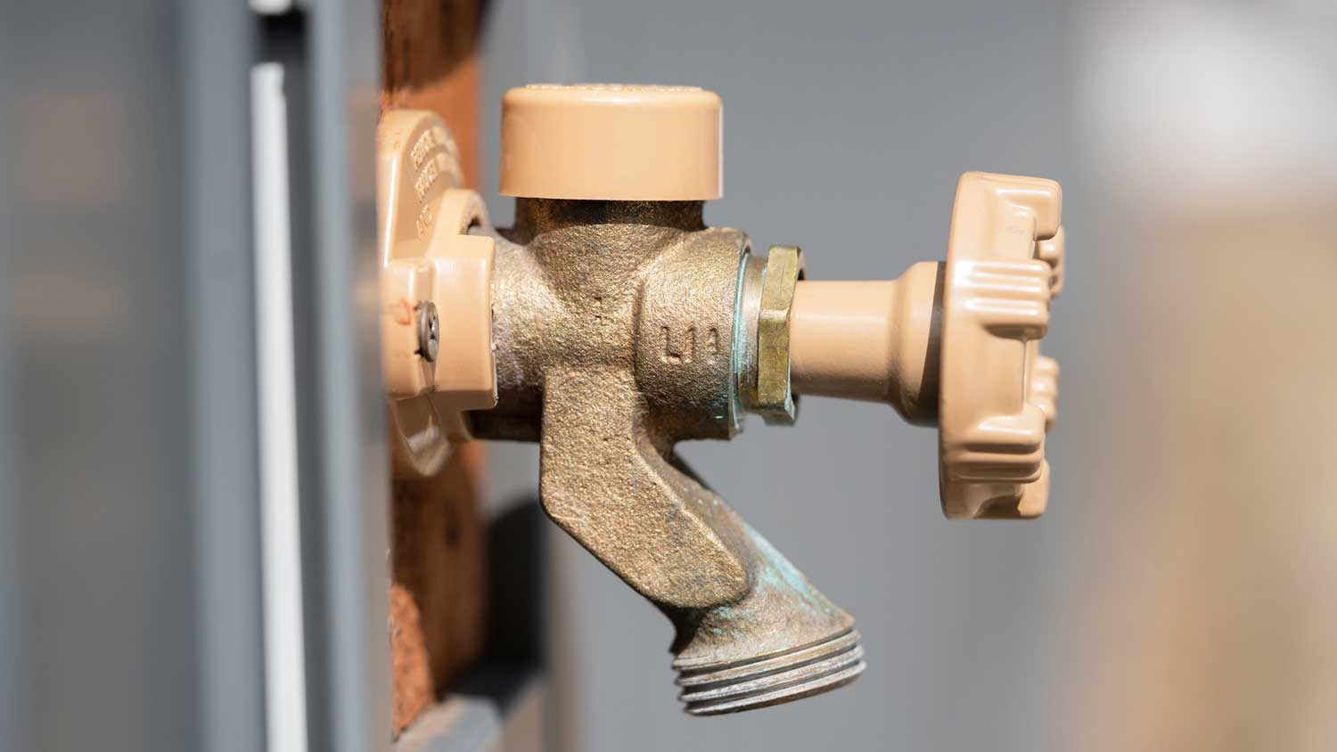 Anti-siphon outdoor faucet on the wall