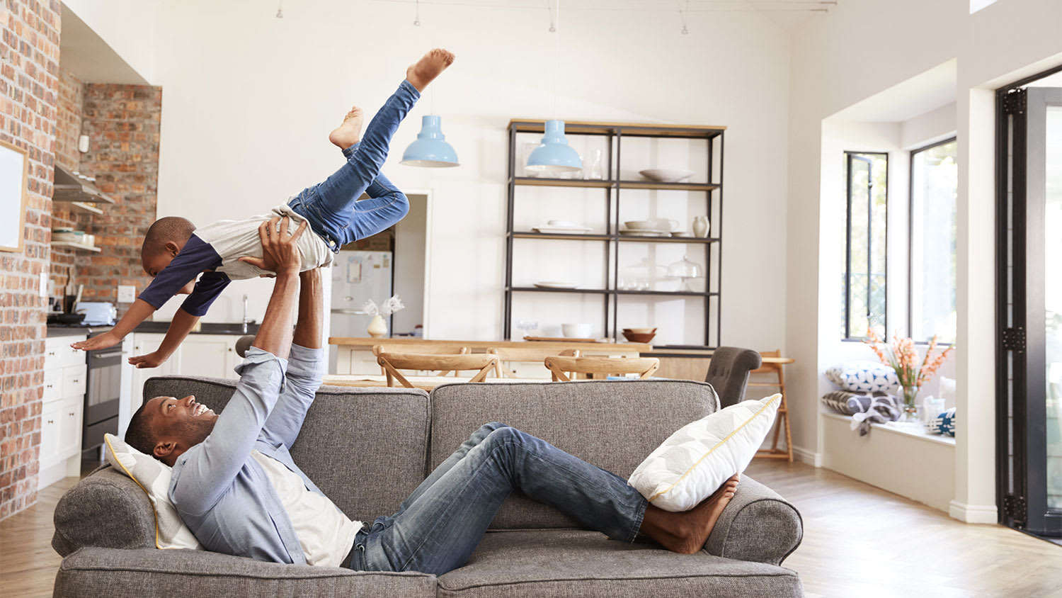Father and son playing at home