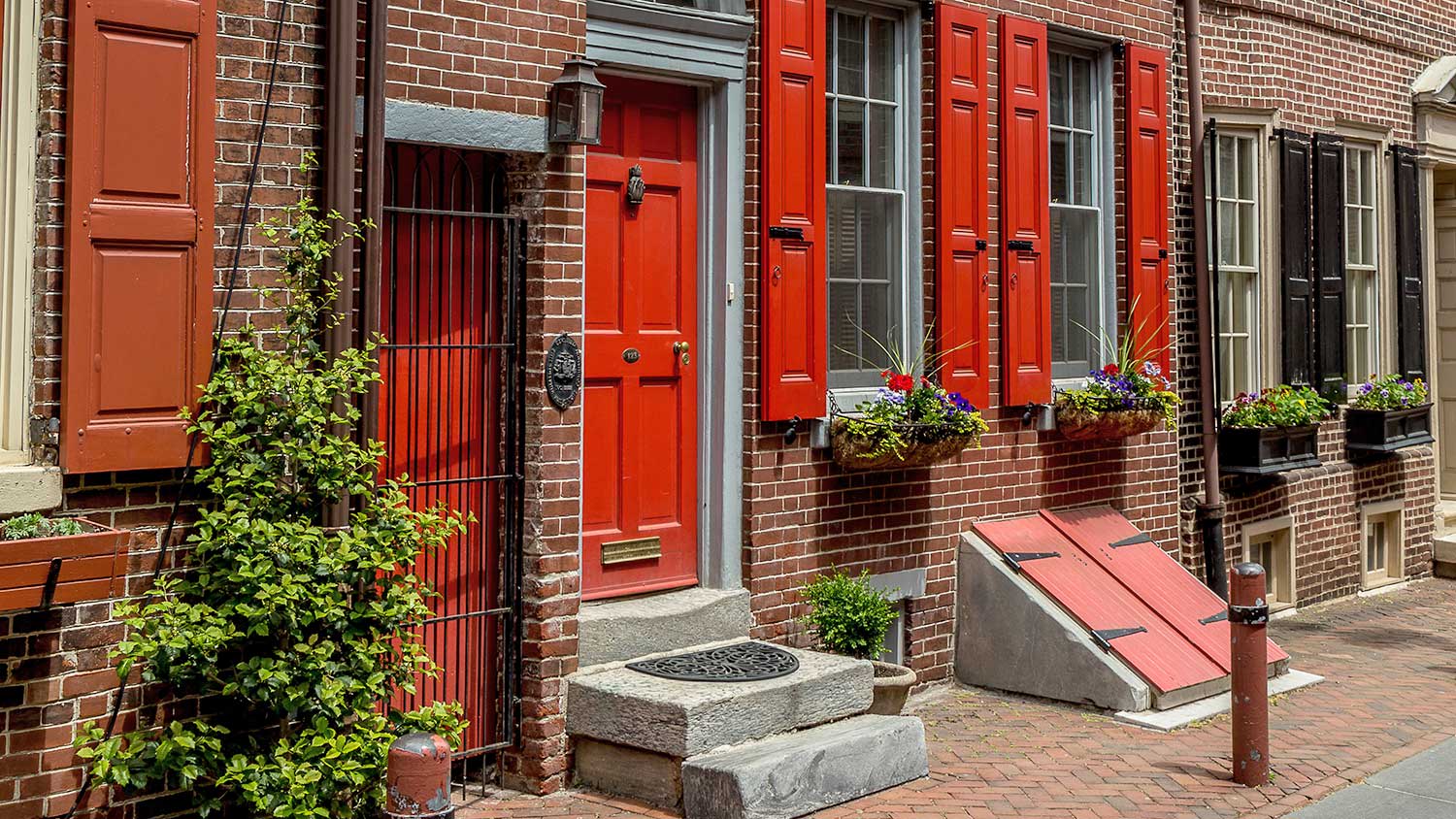 Row of brick houses with a below-ground storm shelter