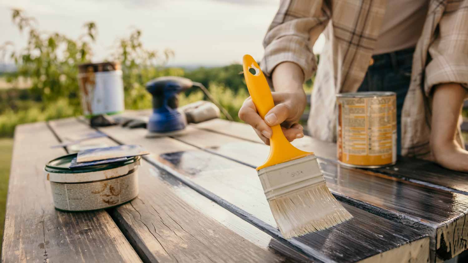 Woman painting old table