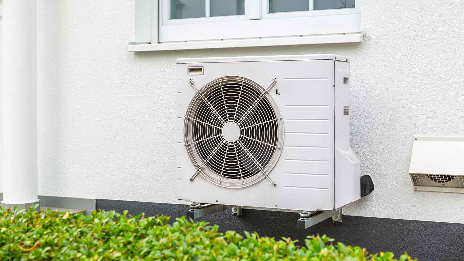 Air source heat pump installed outside of the house