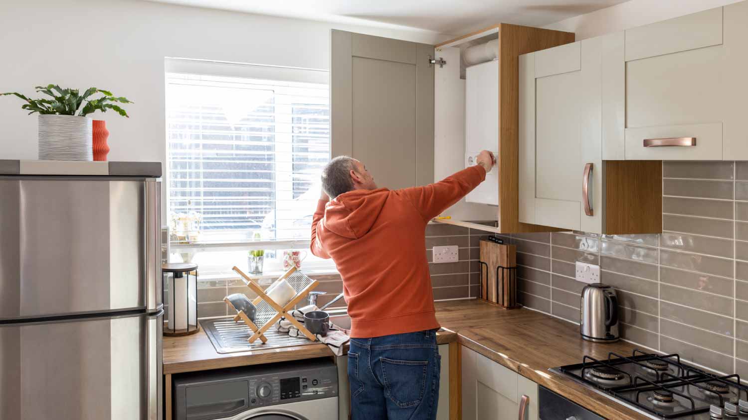 Adjusting boiler in the kitchen