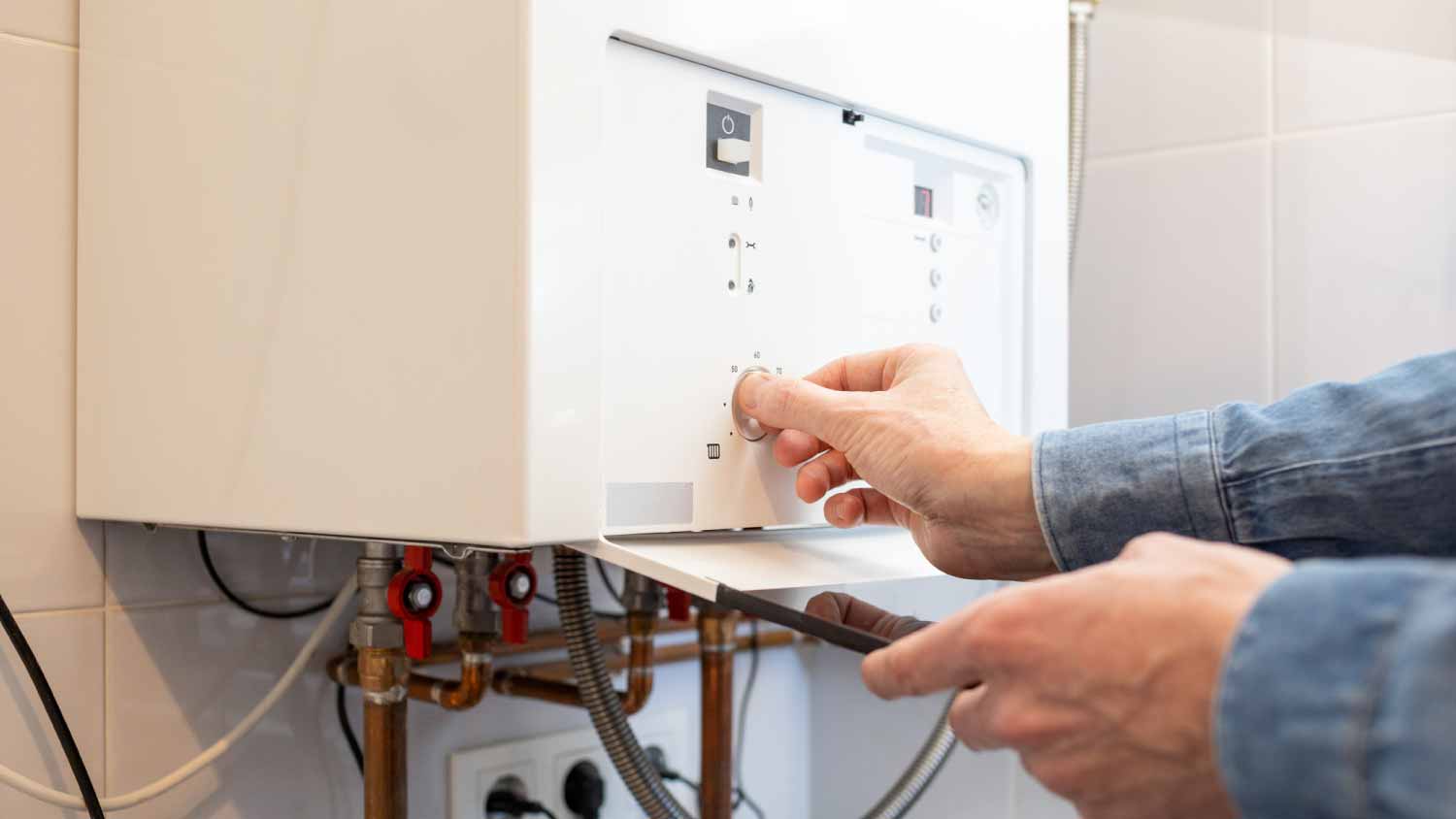 Man checking gas boiler