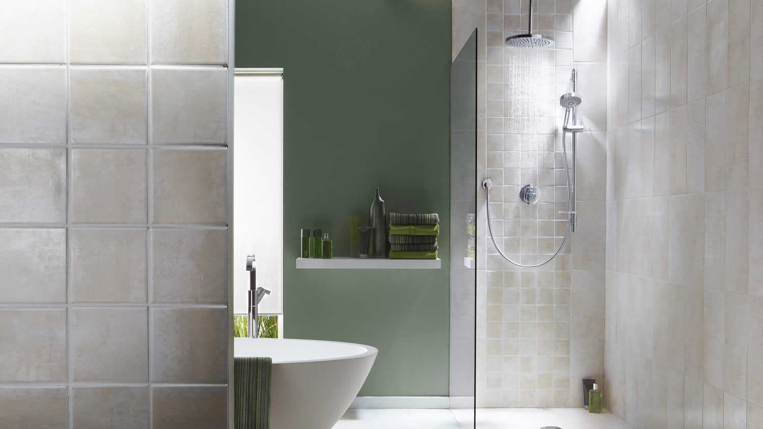 A modern bathroom in green tone with a shower