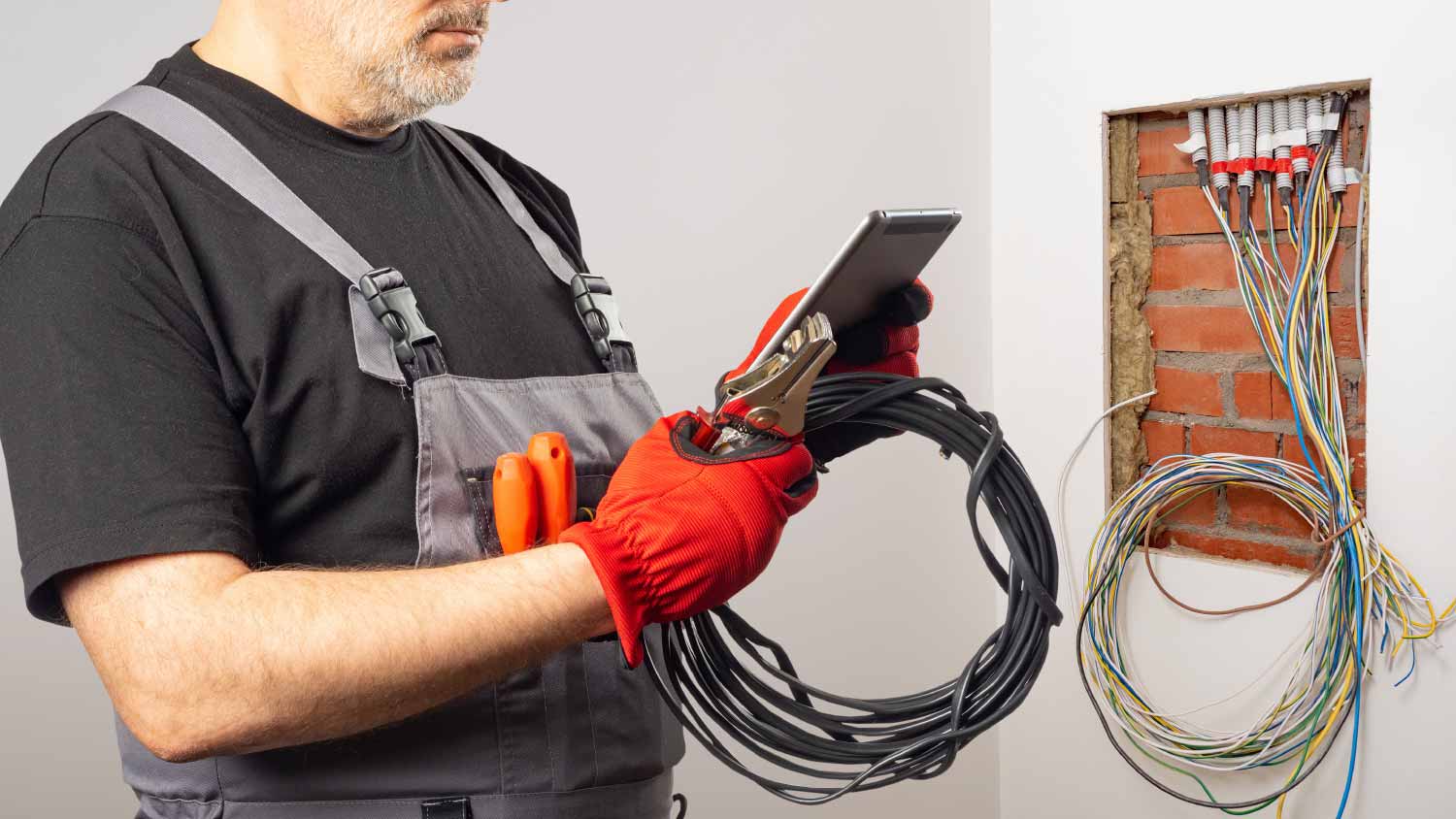 Electrician holding wires