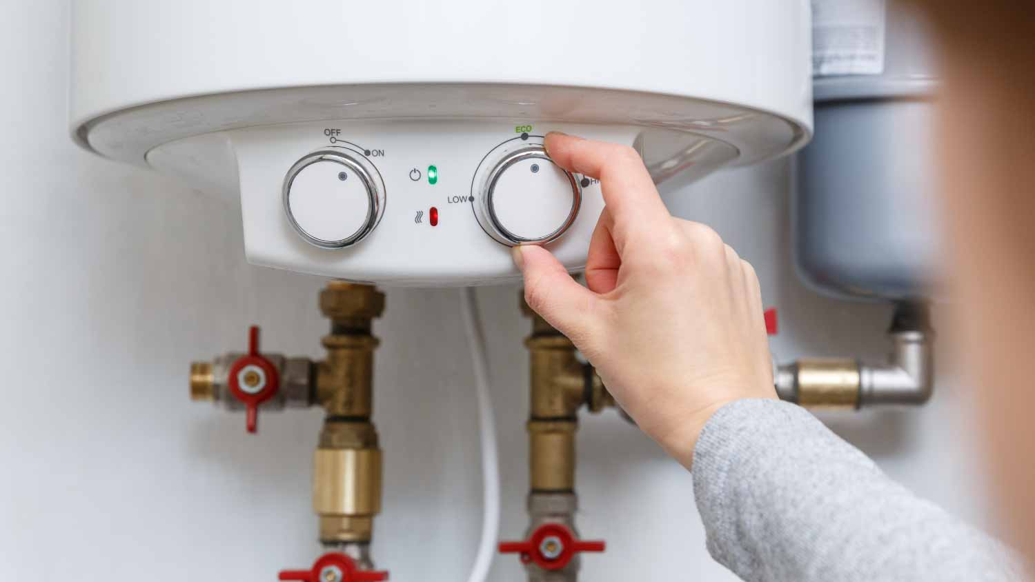 Woman checking boiler