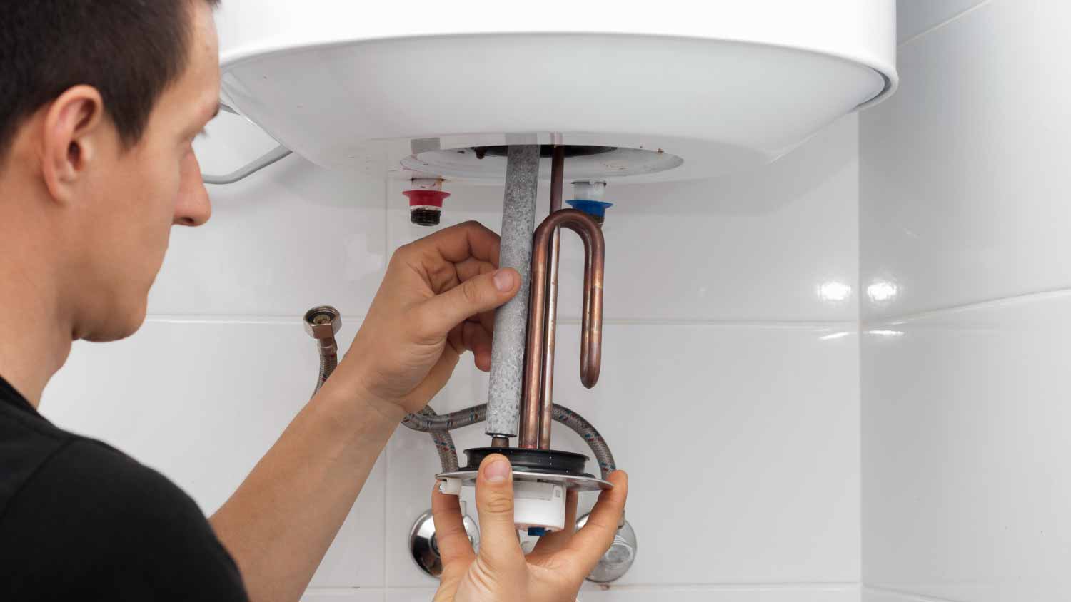 Man repairing a boiler
