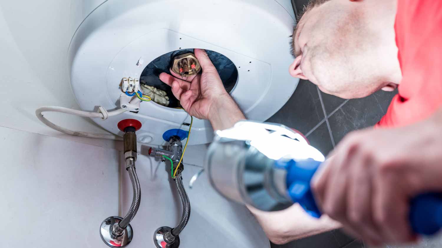 Man repairing electric boiler