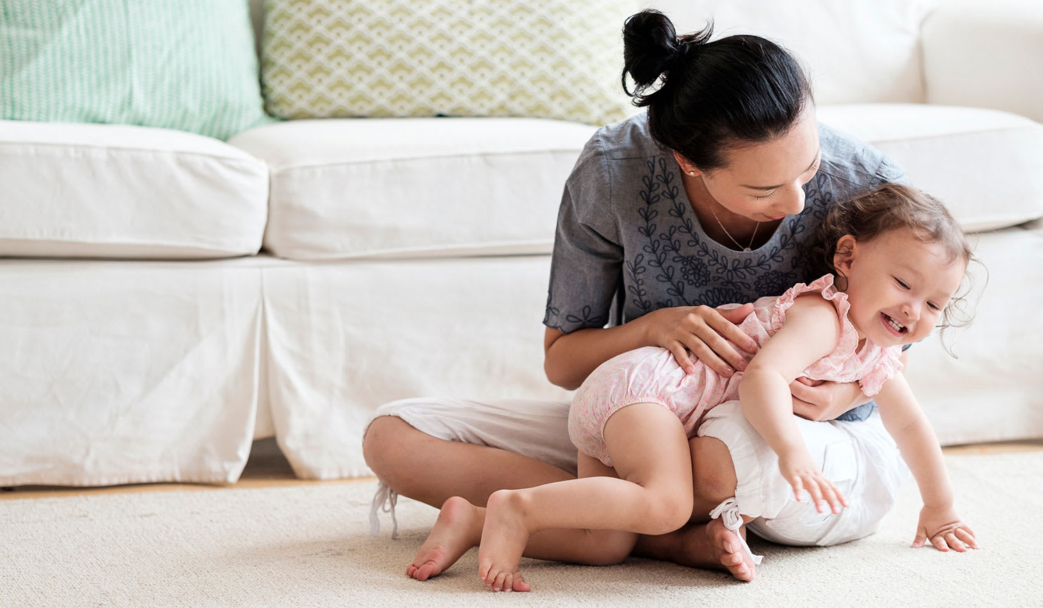 Mom and baby on carpet