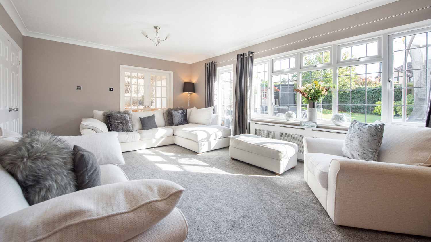 A large and bright carpeted living room