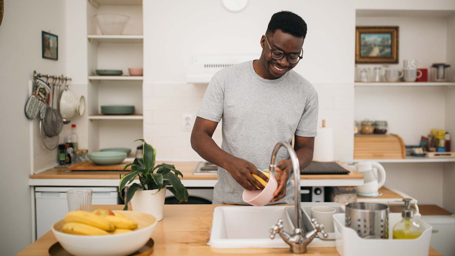 A man washing the dishes