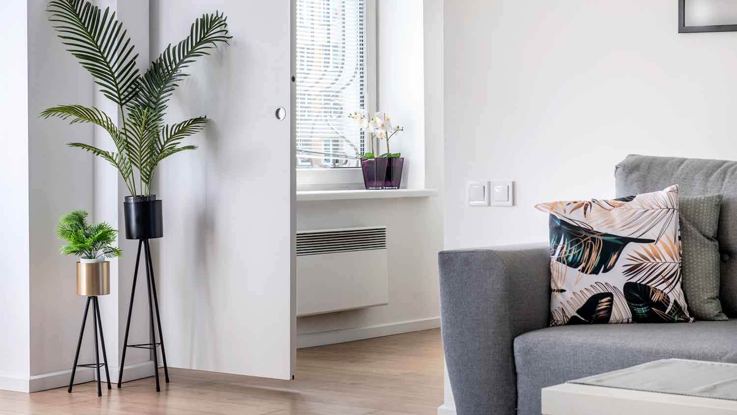 Living room with wall furnace below the window