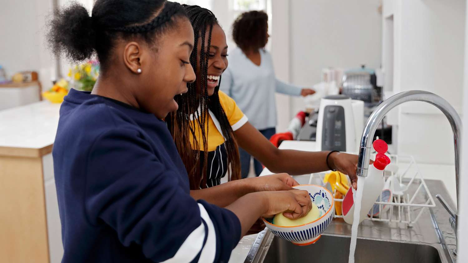 Teenage girls washing the dishes