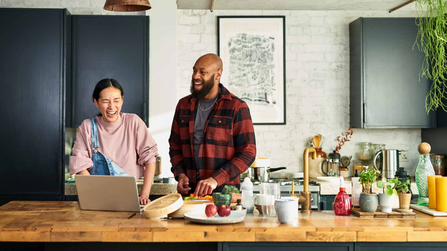 A couple preparing food in the kitchen