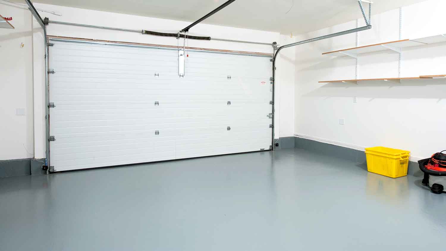 Home garage with painted concrete floor