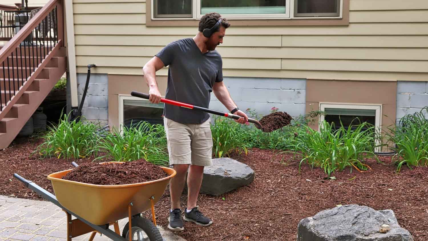 A man mulching the yard
