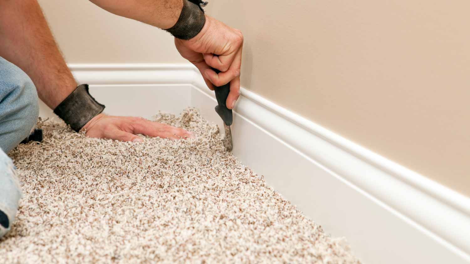 Man installing carpet