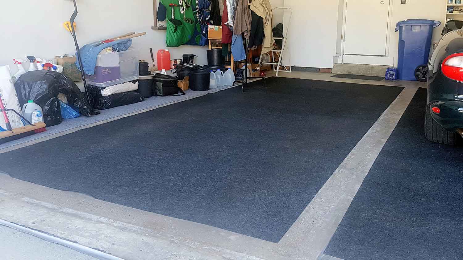 Garage with mats on top of the concrete floor
