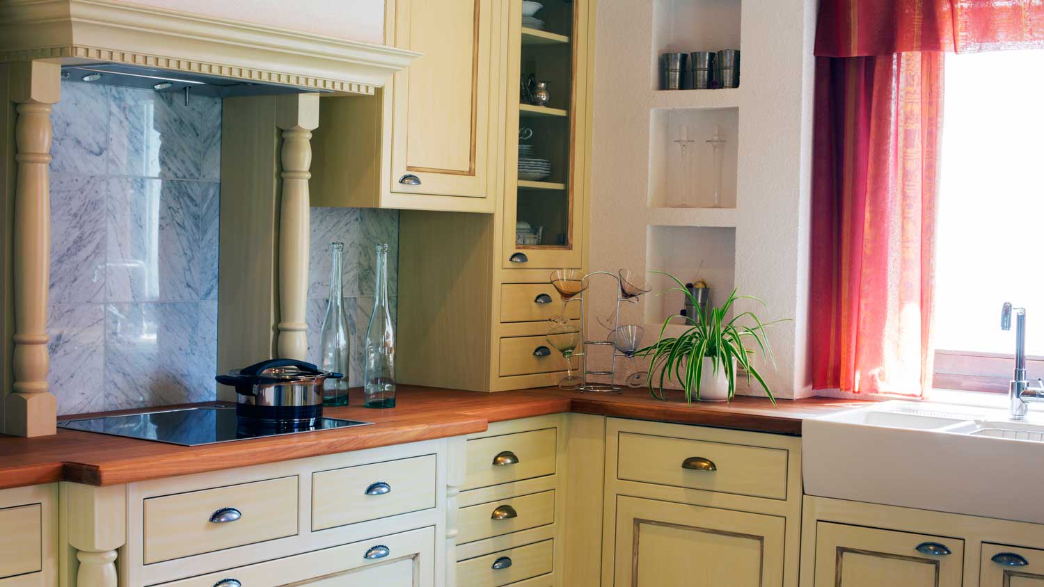 A kitchen with an old wooden countertop