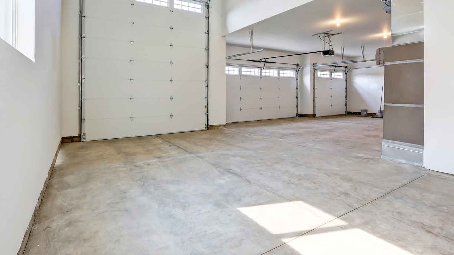 Large garage interior with stained concrete floor