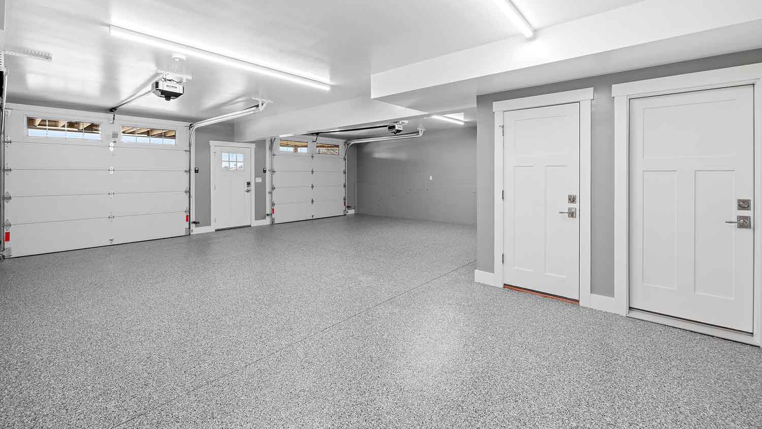 Home garage interior with polyaspartic garage floor coating