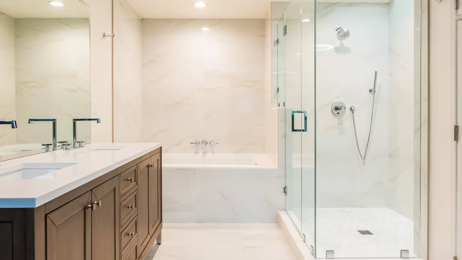 Master bathroom with glass shower and bathtub