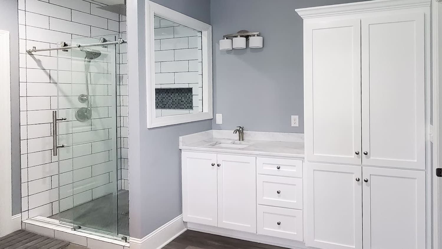 Gray bathroom with glass shower