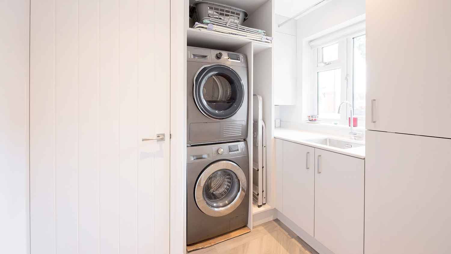 Stackable washer and dryer in a laundry room