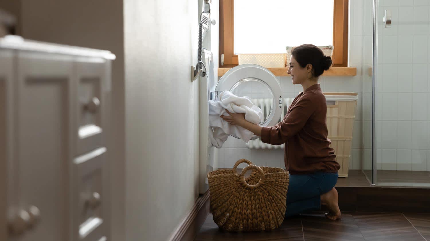 A woman loading the dryer