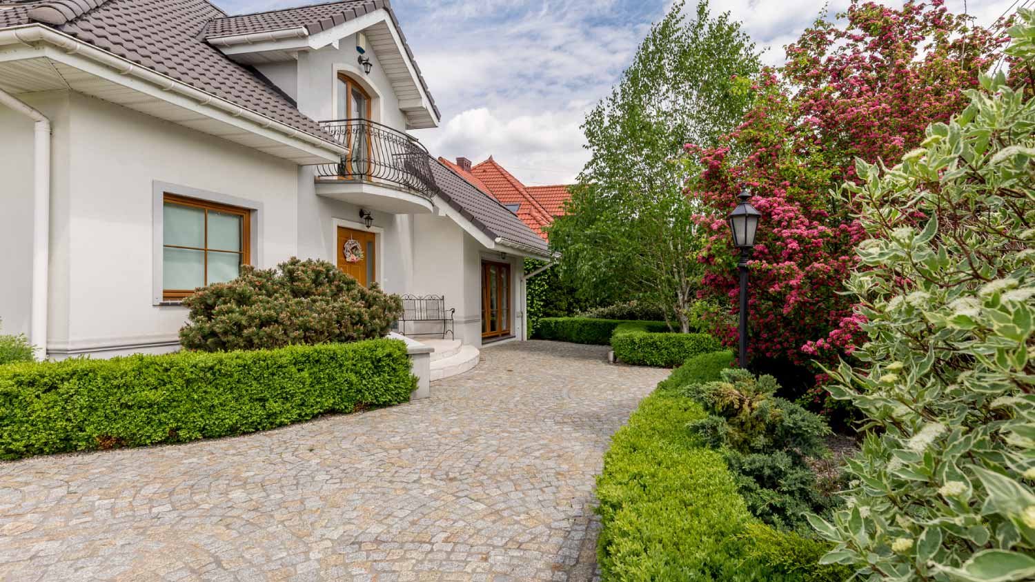 A house with a driveway and garden