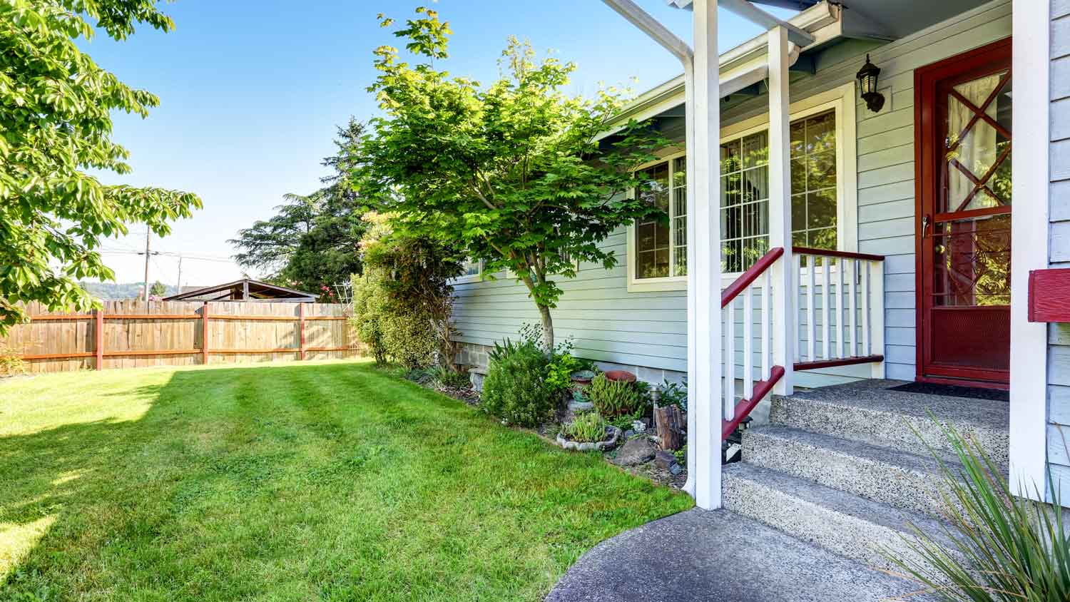 The exterior of a house with blue siding