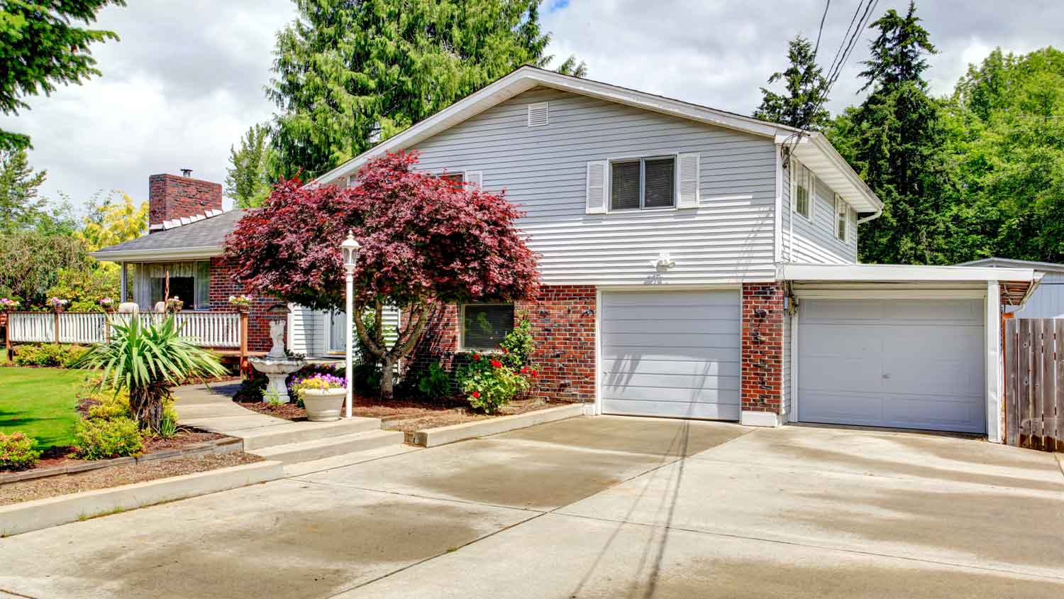 The exterior of a house with a white garage