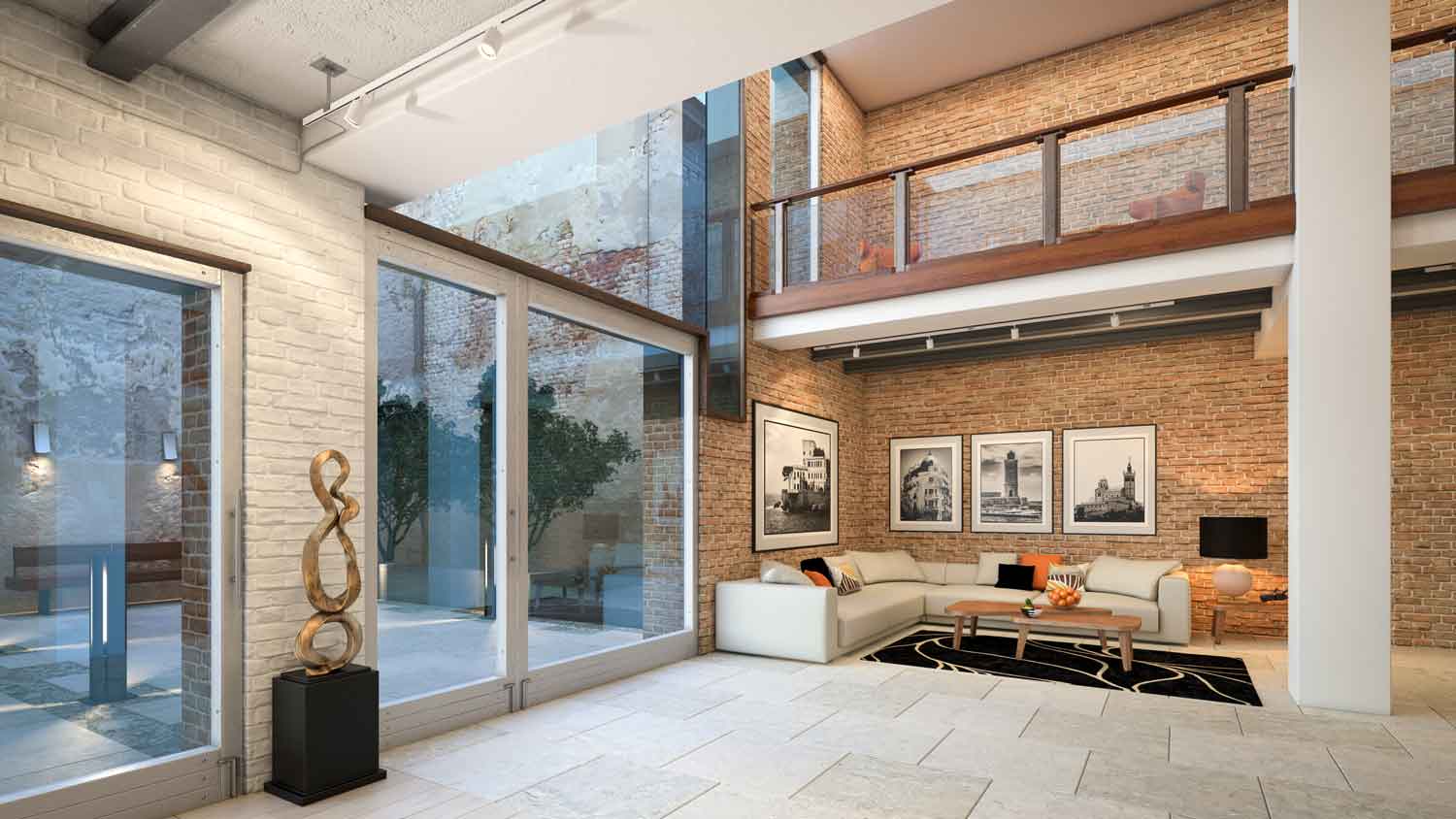 A large living room with pictures hanged on brick wall