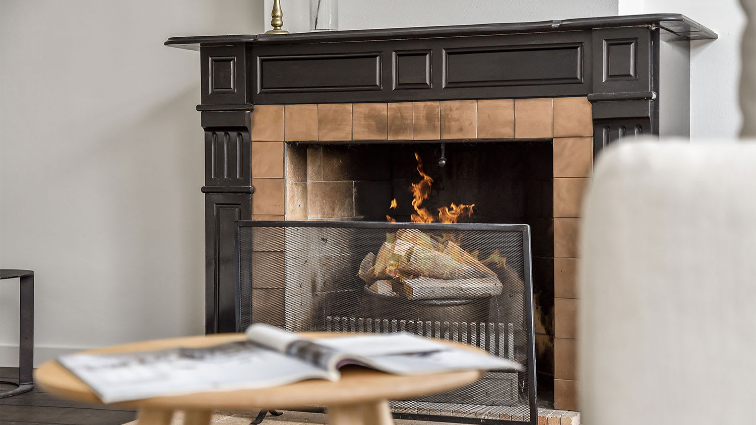 living room with lit fireplace