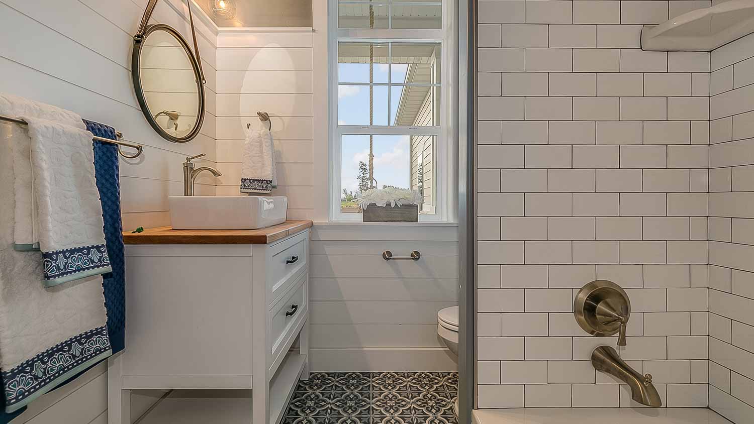 small bathroom with subway tiles in shower