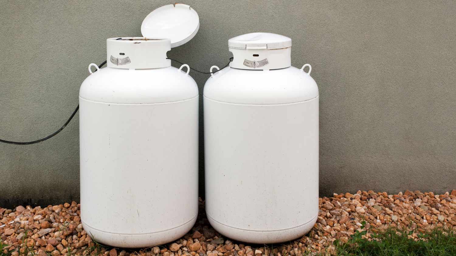 two propane tanks on gravel